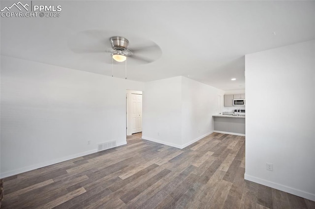 3014 N Moonbeam Cir, Colorado Springs, CO 80916 - unfurnished living room with a ceiling fan, wood finished floors, and recessed lighting