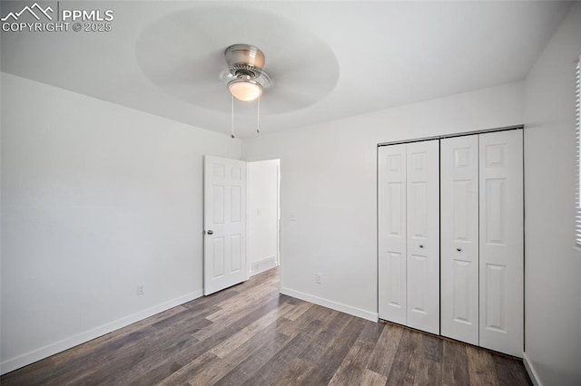 3014 N Moonbeam Cir, Colorado Springs, CO 80916 - unfurnished bedroom with dark wood-style flooring, a closet, and ceiling fan