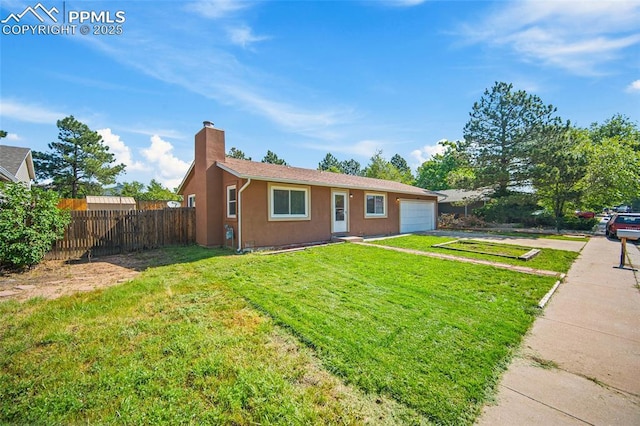 3014 N Moonbeam Cir, Colorado Springs, CO 80916 - single story home with asphalt driveway, a chimney, a garage, and stucco siding
