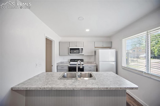 3014 N Moonbeam Cir, Colorado Springs, CO 80916 - kitchen featuring stainless steel microwave, freestanding refrigerator, gray cabinets, electric range, and dark wood-style flooring