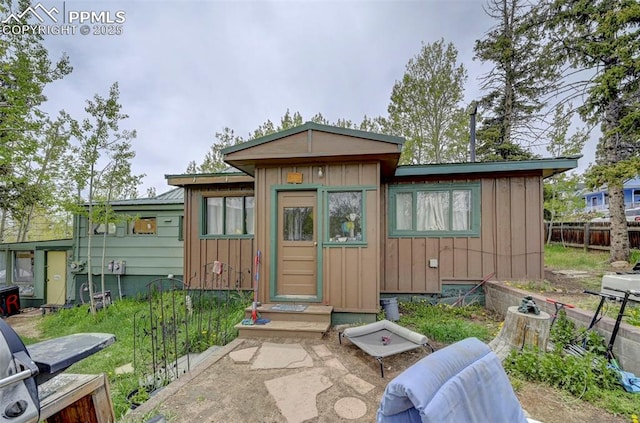 128 W Eaton Ave, Cripple Creek, CO 80813 - view of front of house with board and batten siding