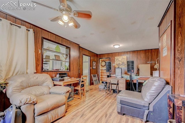 128 W Eaton Ave, Cripple Creek, CO 80813 - office space featuring wood walls, light wood-style floors, and ceiling fan