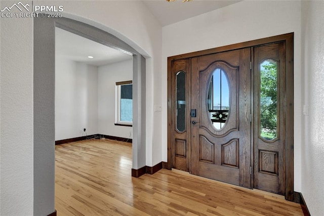 11354 Mckissick Rd, Peyton, CO 80831 - entrance foyer featuring arched walkways and light wood-style flooring