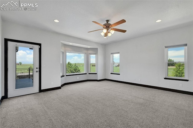 11354 Mckissick Rd, Peyton, CO 80831 - carpeted empty room with a ceiling fan and recessed lighting