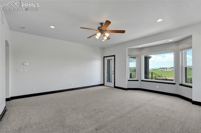 11354 Mckissick Rd, Peyton, CO 80831 - spare room featuring carpet, ceiling fan, recessed lighting, and arched walkways