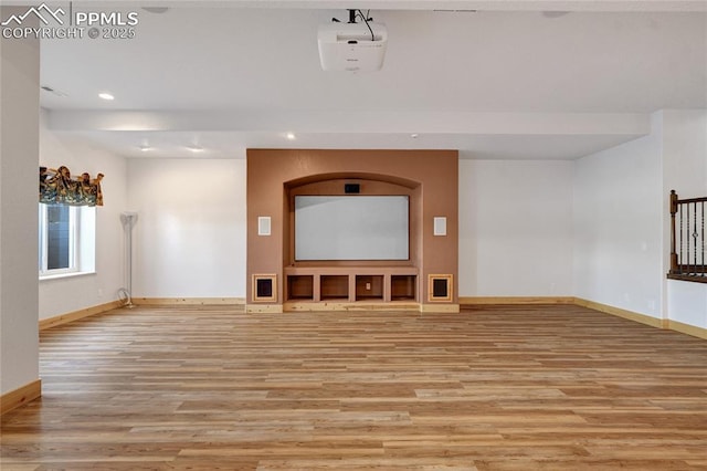 11354 Mckissick Rd, Peyton, CO 80831 - unfurnished living room with light wood finished floors and recessed lighting