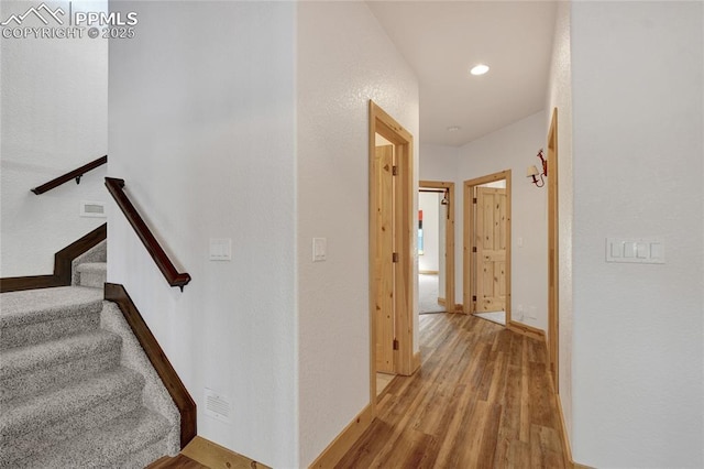 11354 Mckissick Rd, Peyton, CO 80831 - stairway featuring wood finished floors and recessed lighting