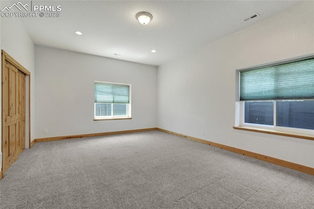 11354 Mckissick Rd, Peyton, CO 80831 - spare room featuring light colored carpet and recessed lighting