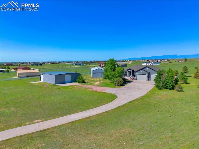 11354 Mckissick Rd, Peyton, CO 80831 - view of community with a yard, an outbuilding, and concrete driveway