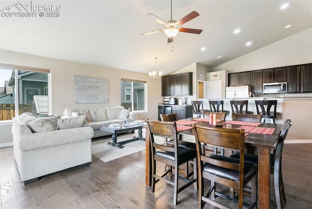 6862 Simcoe Dr, Colorado Springs, CO 80925 - dining room with ceiling fan, vaulted ceiling, dark wood-style floors, a chandelier, and recessed lighting