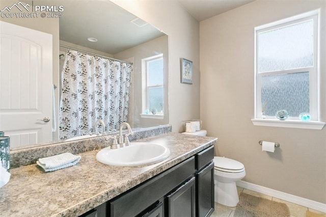 6862 Simcoe Dr, Colorado Springs, CO 80925 - full bathroom featuring vanity, toilet, baseboards, tile patterned flooring, and a shower with curtain