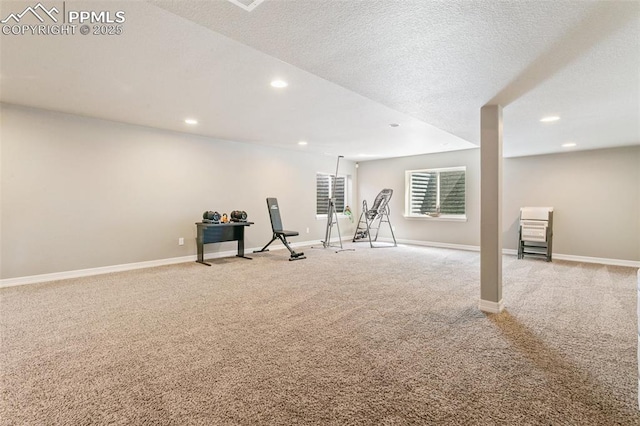 6862 Simcoe Dr, Colorado Springs, CO 80925 - exercise area featuring light carpet, recessed lighting, baseboards, and a textured ceiling