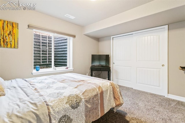 6862 Simcoe Dr, Colorado Springs, CO 80925 - bedroom with carpet flooring, a closet, and baseboards