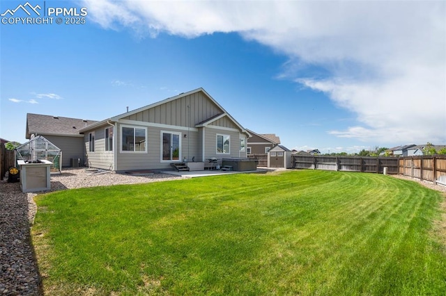 6862 Simcoe Dr, Colorado Springs, CO 80925 - rear view of house featuring board and batten siding, a patio area, and central air condition unit