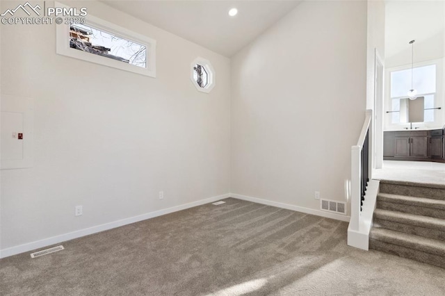 629 E Monument St, Colorado Springs, CO 80903 - basement featuring carpet flooring, baseboards, stairway, and recessed lighting