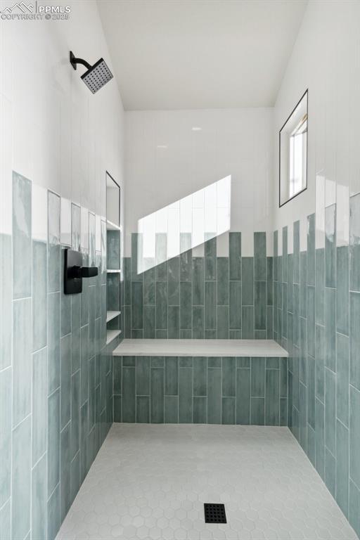 629 E Monument St, Colorado Springs, CO 80903 - full bath with a tile shower and tile walls