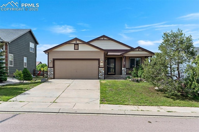 55 Misty Creek Dr, Monument, CO 80132 - craftsman-style house with an attached garage, a front yard, concrete driveway, and stone siding