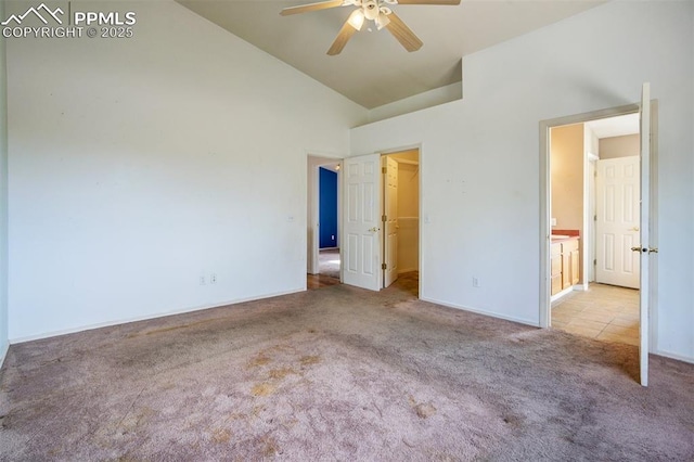 55 Misty Creek Dr, Monument, CO 80132 - unfurnished bedroom featuring carpet, a walk in closet, high vaulted ceiling, and ceiling fan