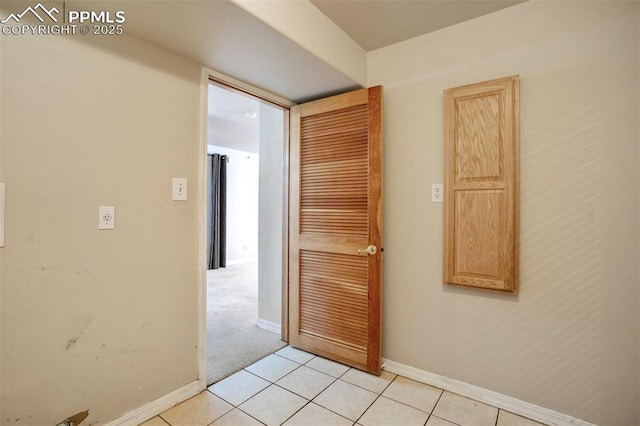55 Misty Creek Dr, Monument, CO 80132 - corridor featuring baseboards and light tile patterned floors