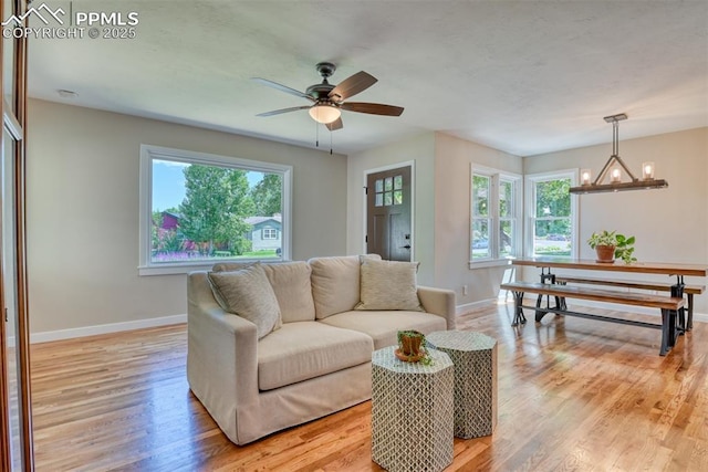 1445 N Foote Ave, Colorado Springs, CO 80909 - living room with healthy amount of natural light, light wood finished floors, and a ceiling fan