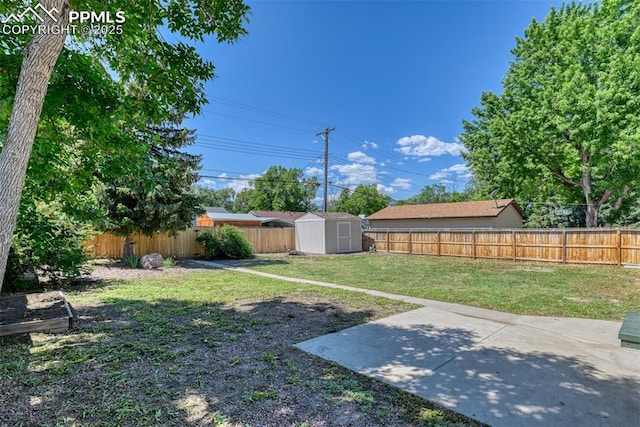 1445 N Foote Ave, Colorado Springs, CO 80909 - fenced backyard featuring a storage unit and a patio