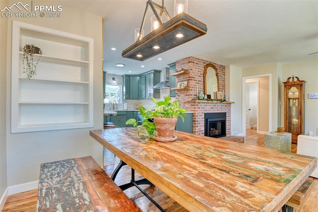 1445 N Foote Ave, Colorado Springs, CO 80909 - dining area featuring a brick fireplace, recessed lighting, and built in features