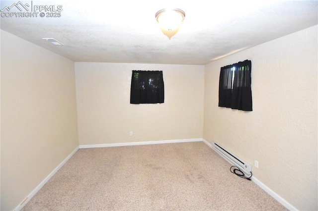 719 Lansing Dr, Colorado Springs, CO 80909 - empty room featuring baseboard heating and carpet floors