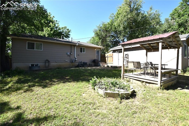 719 Lansing Dr, Colorado Springs, CO 80909 - rear view of house featuring a deck and a gazebo