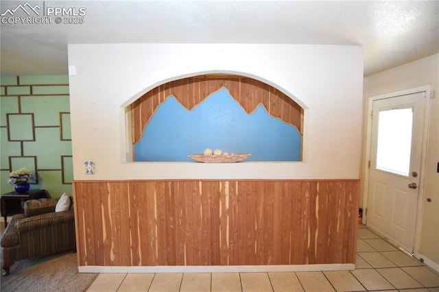 719 Lansing Dr, Colorado Springs, CO 80909 - tiled entryway with wood walls and wainscoting