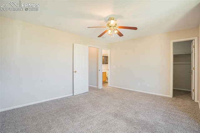 4585 W Jet Wing Cir, Colorado Springs, CO 80916 - unfurnished bedroom featuring carpet floors, a spacious closet, baseboards, ceiling fan, and a closet