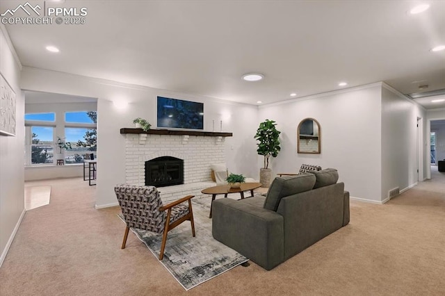 78 Raven Hills Ct, Colorado Springs, CO 80919 - living room featuring light colored carpet, a brick fireplace, recessed lighting, and ornamental molding