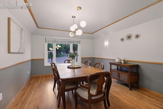 78 Raven Hills Ct, Colorado Springs, CO 80919 - dining space with light wood-style floors and a chandelier