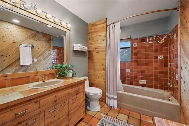 78 Raven Hills Ct, Colorado Springs, CO 80919 - full bath with vanity, tile patterned floors, shower / bath combo with shower curtain, and wood walls