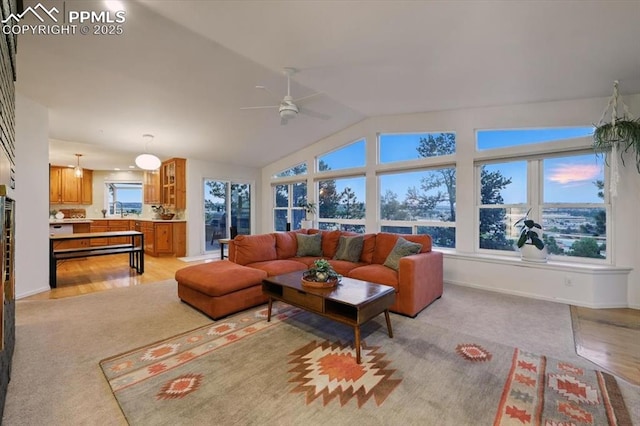 78 Raven Hills Ct, Colorado Springs, CO 80919 - living room with a ceiling fan, lofted ceiling, and light carpet