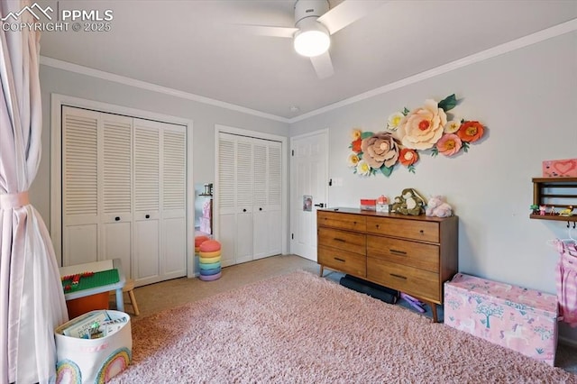 78 Raven Hills Ct, Colorado Springs, CO 80919 - bedroom with two closets, carpet, ornamental molding, and a ceiling fan