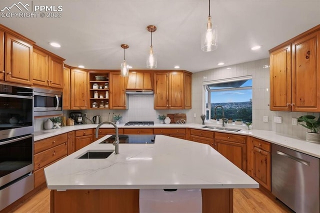 78 Raven Hills Ct, Colorado Springs, CO 80919 - kitchen featuring stainless steel appliances, brown cabinets, and recessed lighting