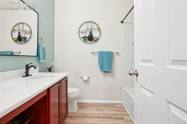 7845 Morning Dew Rd, Colorado Springs, CO 80908 - bathroom with vanity, wood finished floors, and shower / tub combination