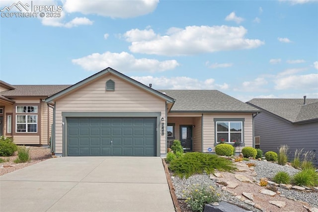 7845 Morning Dew Rd, Colorado Springs, CO 80908 - ranch-style house with concrete driveway and a garage