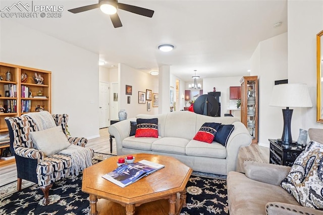 7845 Morning Dew Rd, Colorado Springs, CO 80908 - living room featuring light wood-type flooring, a chandelier, and ceiling fan