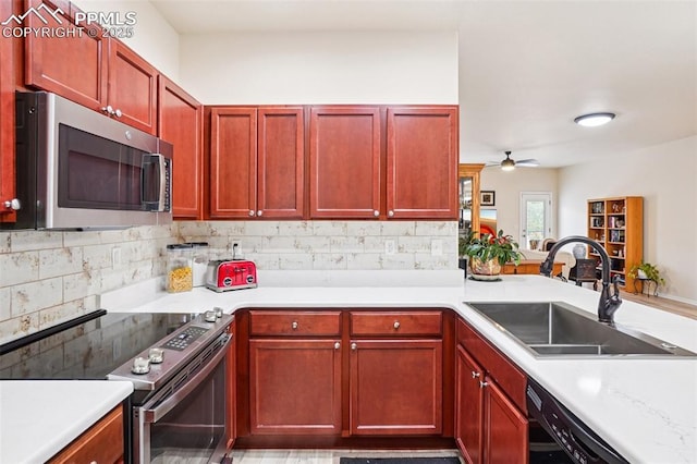 7845 Morning Dew Rd, Colorado Springs, CO 80908 - kitchen featuring stainless steel appliances, dark brown cabinets, a ceiling fan, and decorative backsplash