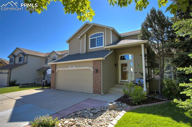 6055 Fescue Dr, Colorado Springs, CO 80923 - traditional-style house featuring brick siding, concrete driveway, a shingled roof, and a garage