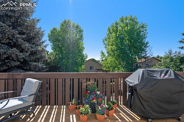 6055 Fescue Dr, Colorado Springs, CO 80923 - wooden terrace with a grill