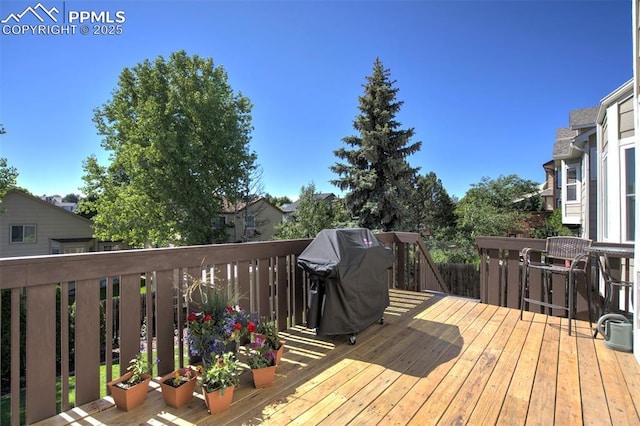 6055 Fescue Dr, Colorado Springs, CO 80923 - wooden deck featuring area for grilling