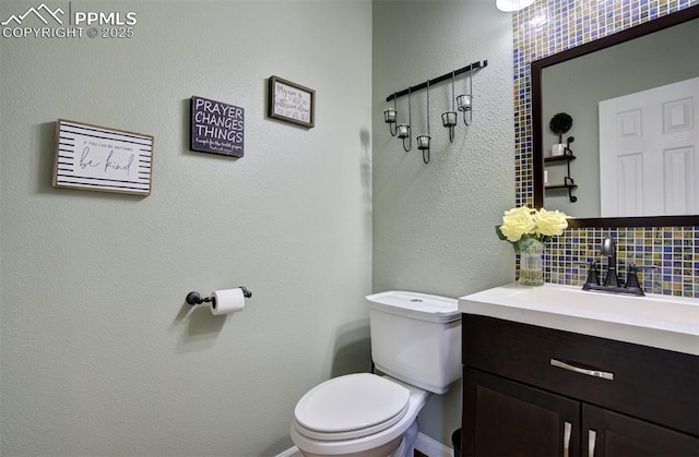 6055 Fescue Dr, Colorado Springs, CO 80923 - half bathroom with backsplash, vanity, and a textured wall
