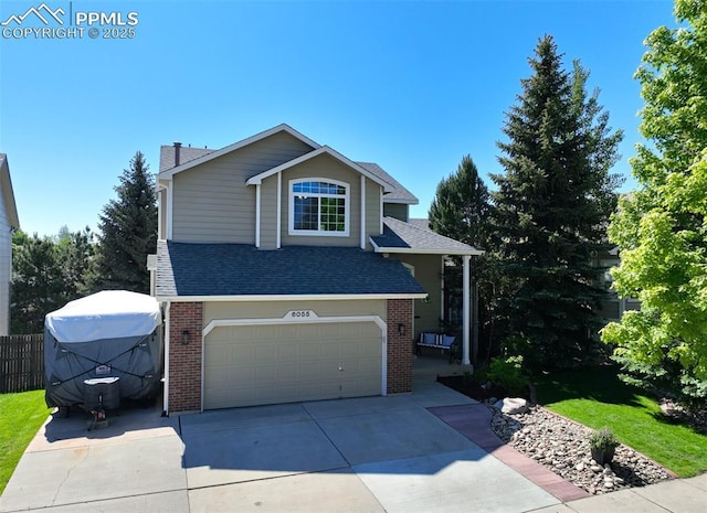 6055 Fescue Dr, Colorado Springs, CO 80923 - traditional-style home featuring brick siding, an attached garage, concrete driveway, and a shingled roof