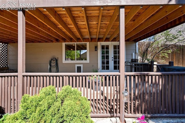 6055 Fescue Dr, Colorado Springs, CO 80923 - view of patio / terrace with french doors and a wooden deck