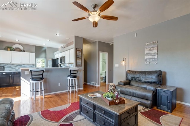 6055 Fescue Dr, Colorado Springs, CO 80923 - living room with a ceiling fan and light wood-type flooring