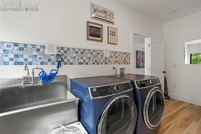 1607 W Pikes Peak Ave, Colorado Springs, CO 80904 - laundry room with washer and dryer and wood finished floors