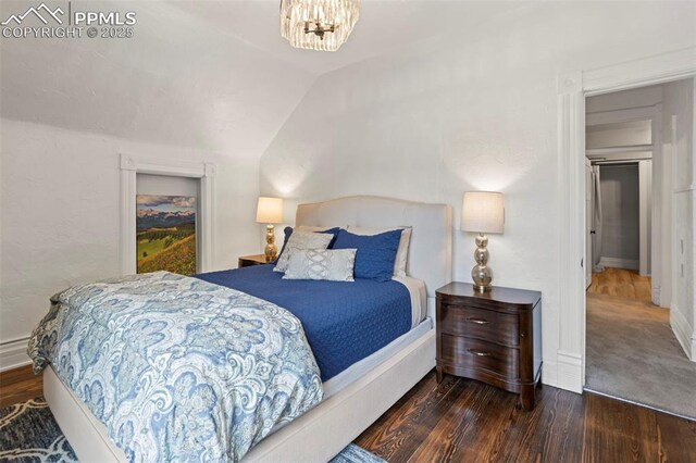 1607 W Pikes Peak Ave, Colorado Springs, CO 80904 - bedroom with wood finished floors and lofted ceiling