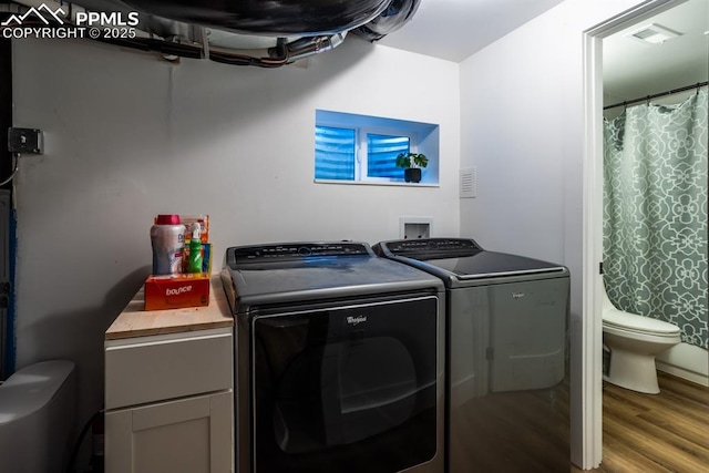 1607 W Pikes Peak Ave, Colorado Springs, CO 80904 - laundry area with separate washer and dryer and wood finished floors